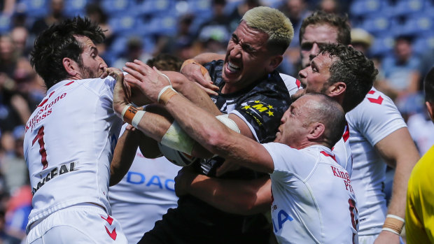 Thwarted: New Zealand's Nelson Asofa-Solomona looks for the try line but is stopped by Stefan Ratchford and James Roby.