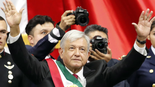 Mexico's new President Andres Manuel Lopez Obrador greets the crowd at the end of his inauguration ceremony at the National Congress in Mexico City, on Saturday.