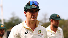 Pat Cummins leads the Australian team off the field.