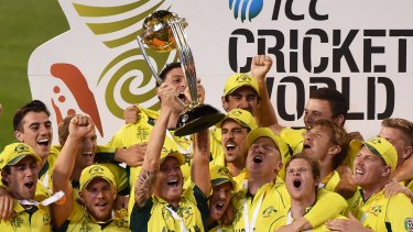 Home heroes: Michael Clarke holds up the 2015 trophy after Australia beat New Zealand in the 50-over World Cup final at the MCG.