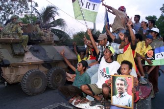 Pro-independence supporters cheering the arrival of Australian troops in Dili, the capital of East Timor.
