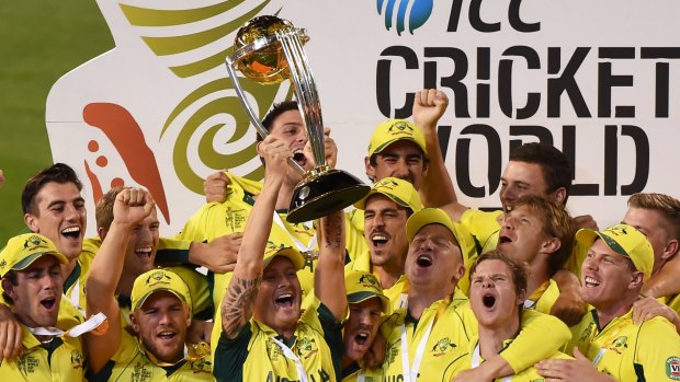Home heroes: Michael Clarke holds up the 2015 trophy after Australia beat New Zealand in the 50-over World Cup final at the MCG.