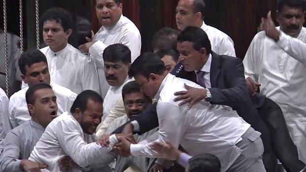 Sri Lankan MPs battle it out in Parliament.