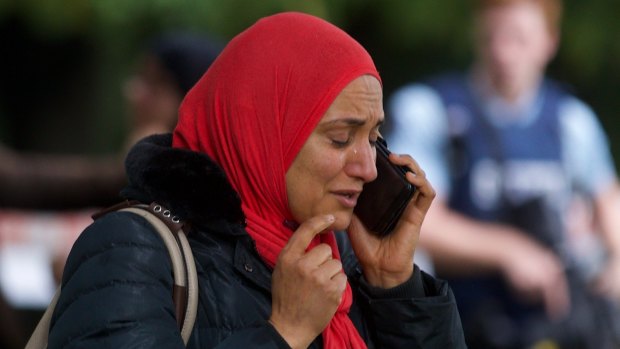 A worshipper emerges from the Deans Ave mosque in Christchurch, hours after a shooter opened fire.