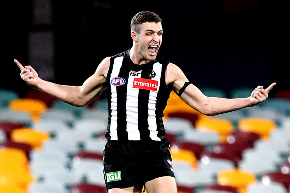 Trey Ruscoe kicks a goal on debut for the Pies.