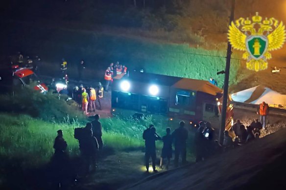 Emergency services respond at the scene of the collapse, in an unverified image.