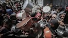 Displaced Palestinians collect cooked food from a community kitchen in Jabalia, northern Gaza, on Monday.