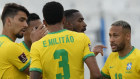 Brazil’s Neymar talks with teammates after the match was interrupted by health authorities.