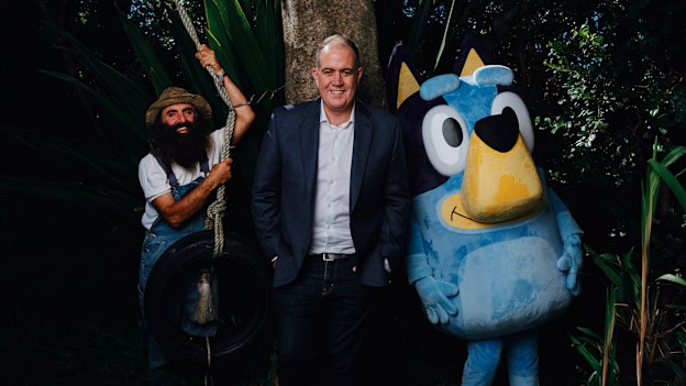 “We upset all sides of politics, simply by holding people to account,” says ABC boss David Anderson, here with Gardening Australia host Costa Georgiadis and Bluey.