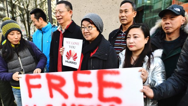 People support Meng Wanzhou, Huawei's chief financial officer on Monday outside a Vancouver courtroom.