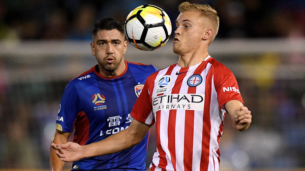 City's Nathaniel Atkinson battles Newcastle's Dimitri Petratos.