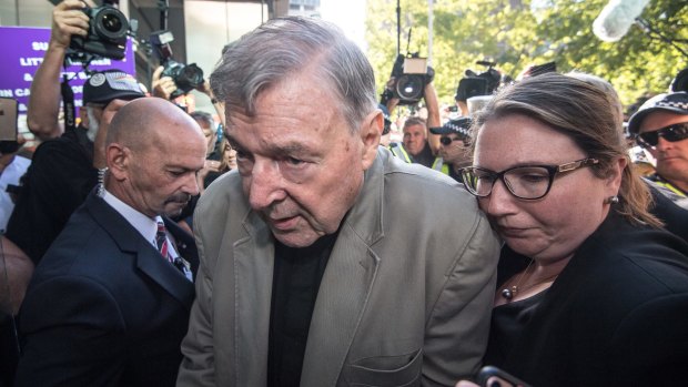 Cardinal George Pell arriving at court yesterday.
