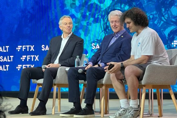 Sam Bankman-Fried on stage with former UK prime minister Tony Blair and former US president Bill Clinton. 