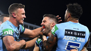 Big Ted: James Tedesco and the Blues celebrate a stunning victory.