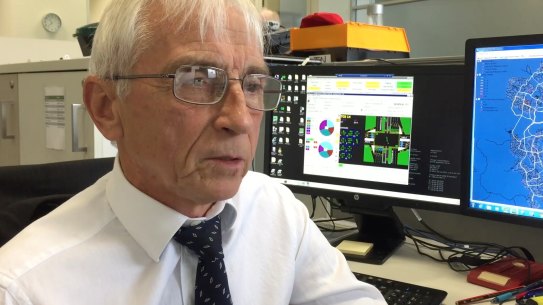 Michael Day and the screens that show how fast - or slow - Canberra traffic moves.