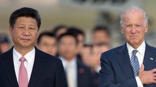  Chinese President Xi Jinping, then Vice-President Joe Biden, stand for the U.S. national anthem during an arrival ceremony in Andrews Air Force Base in 2015. 