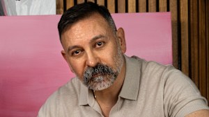 Joseph Hkeik painting at his Bowral home.