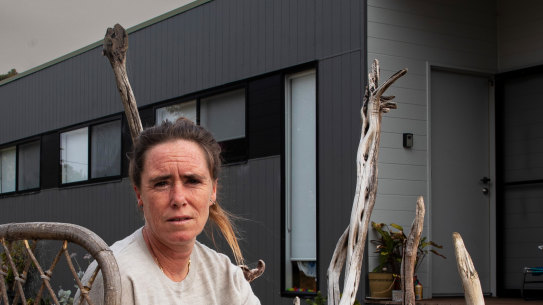 Brooke Robinson at her temporary modular housing in Mallacoota. Three years after the fires