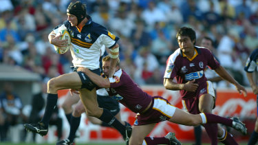 Larkham in action for the Brumbies.