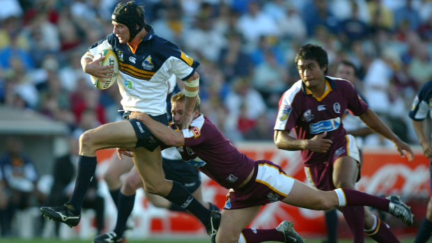 Larkham in action for the Brumbies.