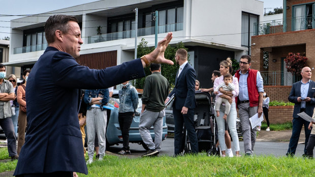 Auctioneer Matthew Harvey in action at 4 Wade Street, Putney.