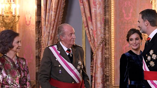 From left, former Spanish queen Sofia and king Juan Carlos, speak to his son King Felipe, right, and his wife Queen Letizia in 2018.