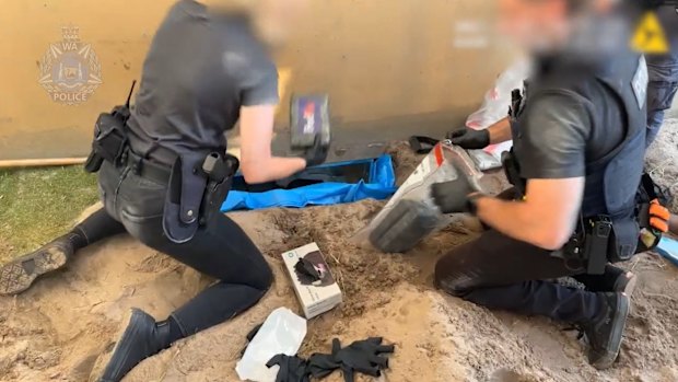 Police making the discovery of a cocaine haul underneath a concrete slab. 