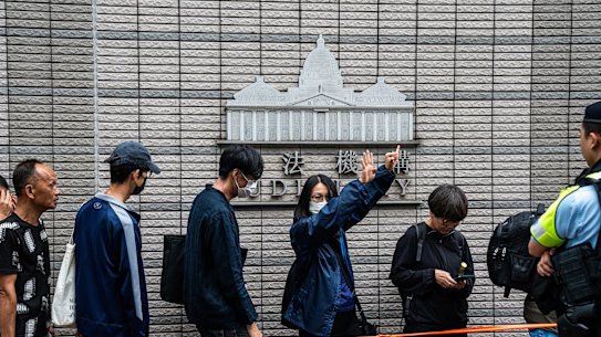 Supporters of opposition figures found guilty in Hong Kong’s largest-yet national security trial outside court late last month.