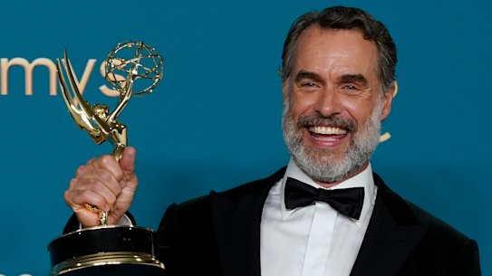 Bartlett celebrates after winning the Emmy for outstanding supporting actor in a limited anthology series or movie for The White Lotus.
