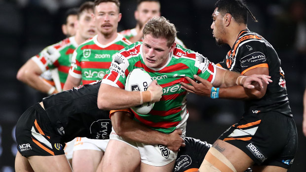 Tom Burgess tries to break the Tigers defence.