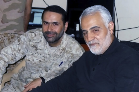 Wissam al-Tawil pictured sitting next to slain Iran’s Quds force General Qassem Soleimani, who was killed in Baghdad by a US. drone strike in January 2020.
