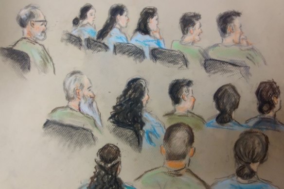 A sketch of the 14 defendants in the trial, all members of a fringe religious group, as they sat in Brisbane Supreme Court.