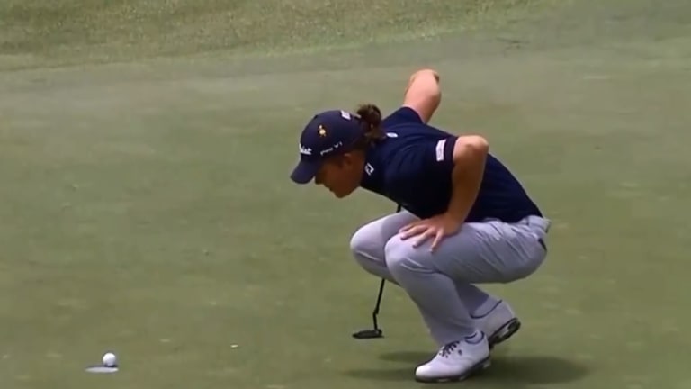 Waiting game: Jake McLeod watches his ball as it sits on the edge of the hole.