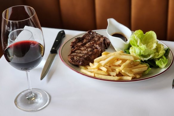 Steak frites is served with either bordelaise or bearnaise sauce and salad at Normandy Wine and Grill.