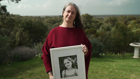 Julie Adams with a photo of her daughter Molly Wilkes.
