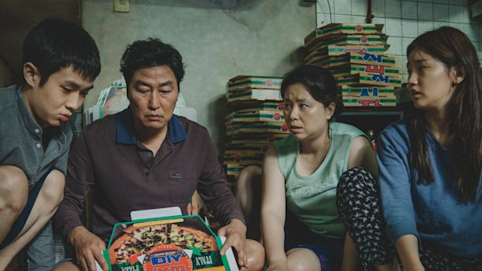 The Kims, a poor family of hustlers, determined to fake it until they make it, in Parasite.