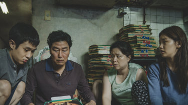 The Kims, a poor family of hustlers determined to fake it until they make it, in Parasite.