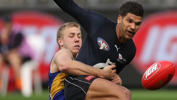 Pinged: Carlton's Sam Petrevski-Seton gets caught by West Coast's Oscar Allen.