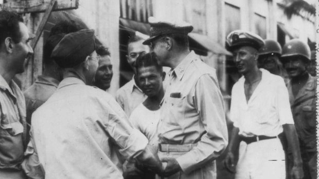 
General Douglas MacArthur greets internees at Santo Tomas on February 13, 1945