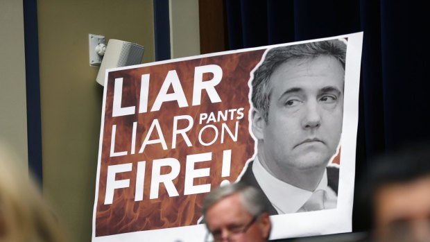 A poster of Michael Cohen at his congressional hearing this week.