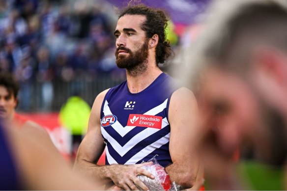 Alex Pearce ices his arm after the match.