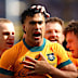 Joseph-Aukuso Suaalii of the Wallabies celebrates with teammates after scoring a try.