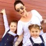 The twins, Macey and Riley, with their mother.