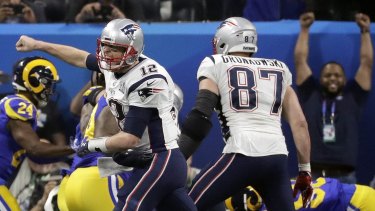 Untouchable: Tom Brady (No.12) celebrates a touch down during Super Bowl LIII.
