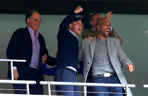 Aston Villa fan Prince William and former player John Carew celebrate.