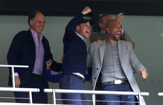 Aston Villa fan Prince William and former player John Carew celebrate.