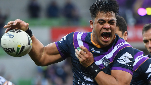 Parting gift: Young Tonumaipea scores a try for Melbourne Storm in his final home game for the club.