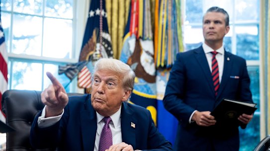 US President Donald Trump and Pete Hegseth, who has a new title of war secretary.