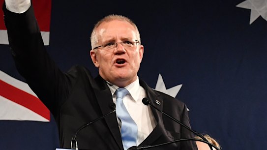 Scott Morrison celebrates his election victory which has come despite a further fall in turnout and an increase in informal votes