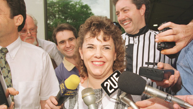 Lindy Chamberlain-Creighton outside Darwin Magistrate's Court after the final verdict. Her husband Rick Creighton is behind her in the striped shirt.